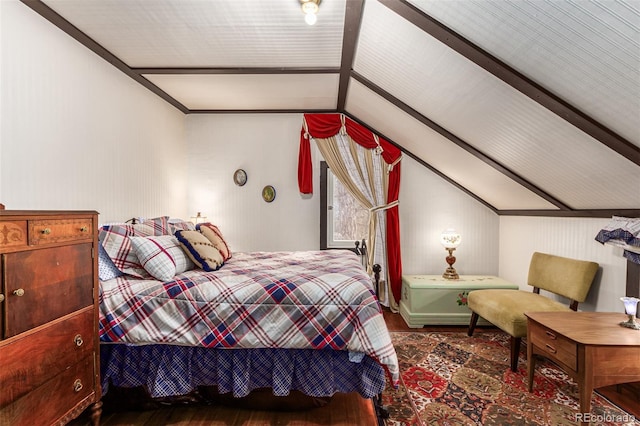 bedroom featuring wood finished floors and vaulted ceiling