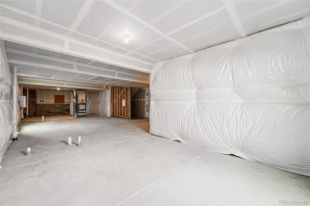 unfurnished living room featuring concrete flooring