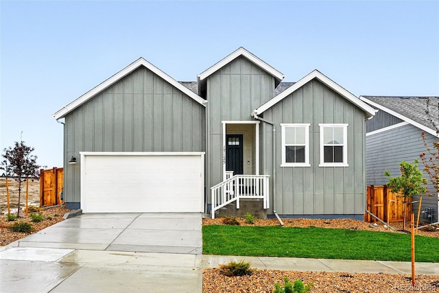view of front of home with an attached garage, board and batten siding, and concrete driveway