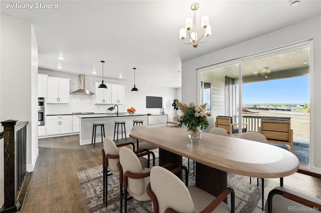 17125 W 92nd Loop, Arvada, CO 80007 - dining area with dark wood-type flooring, recessed lighting, and a chandelier