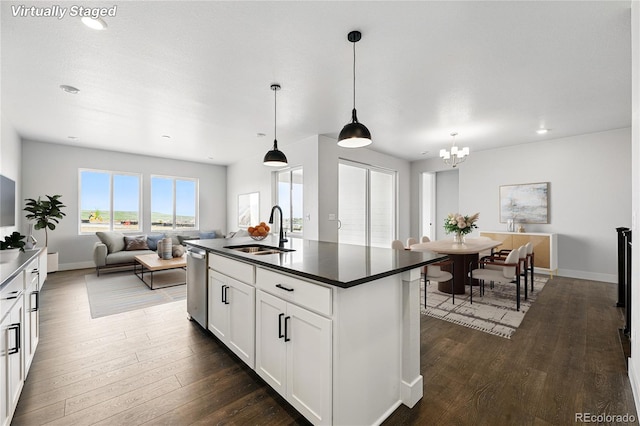 17125 W 92nd Loop, Arvada, CO 80007 - kitchen with a sink, dark countertops, dishwasher, open floor plan, and a chandelier