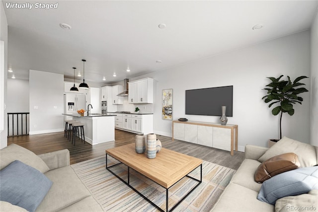 17125 W 92nd Loop, Arvada, CO 80007 - living room featuring dark wood-style flooring, recessed lighting, and baseboards