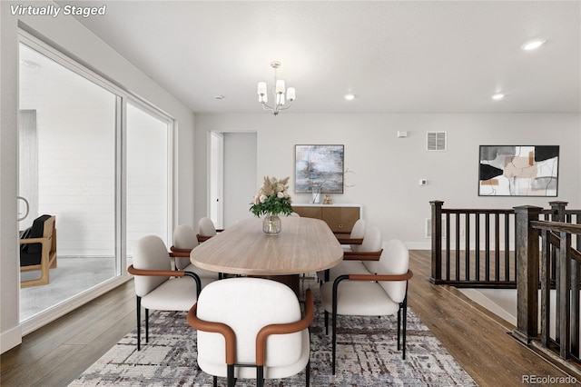 17125 W 92nd Loop, Arvada, CO 80007 - dining room featuring a chandelier, wood finished floors, recessed lighting, and baseboards