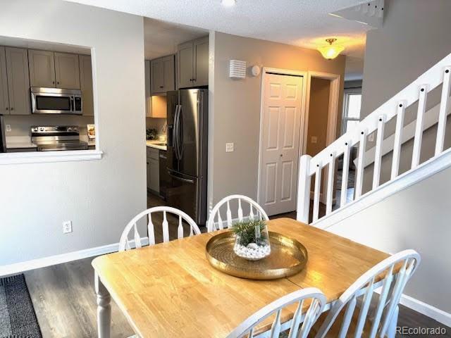 dining room with dark hardwood / wood-style floors