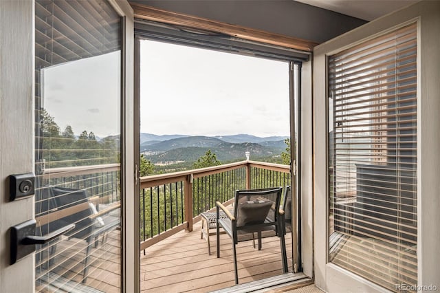 3961 Mossy Rock Ln, Evergreen, CO 80439 - doorway featuring a mountain view and wood finished floors