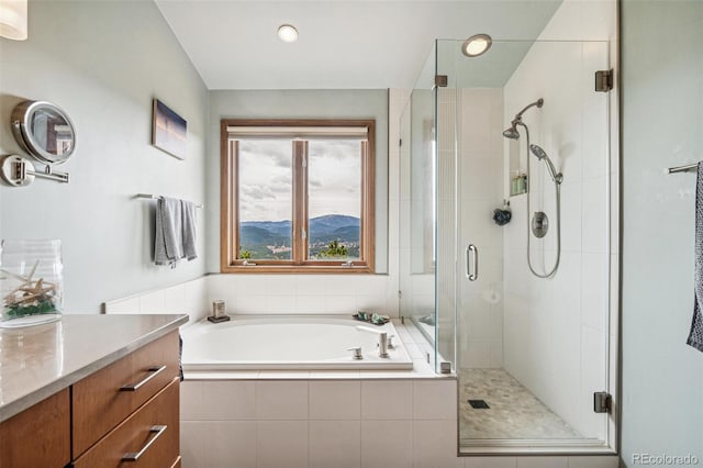 3961 Mossy Rock Ln, Evergreen, CO 80439 - full bath with vanity, a stall shower, and a bath