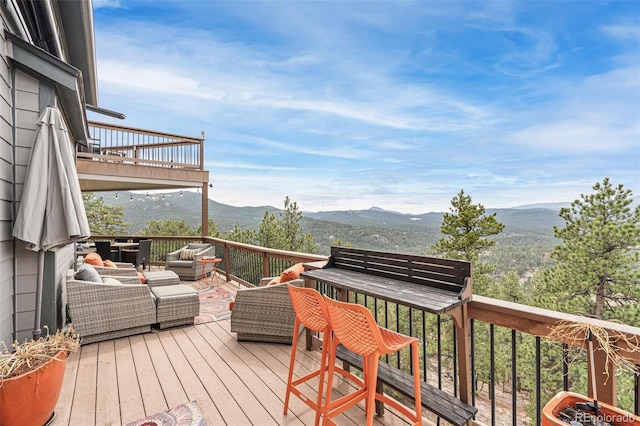 3961 Mossy Rock Ln, Evergreen, CO 80439 - deck with a mountain view and an outdoor living space