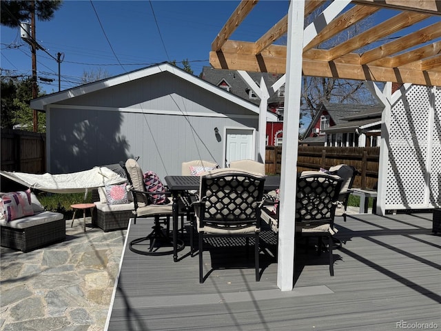 613 S Logan St, Denver, CO 80209 - wooden terrace featuring outdoor dining area, a pergola, and an outbuilding