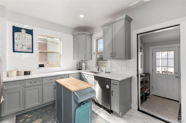 613 S Logan St, Denver, CO 80209 - kitchen featuring gray cabinets, stainless steel dishwasher, backsplash, and recessed lighting