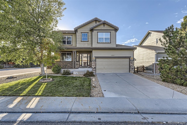 craftsman inspired home featuring a porch, a garage, and a front lawn