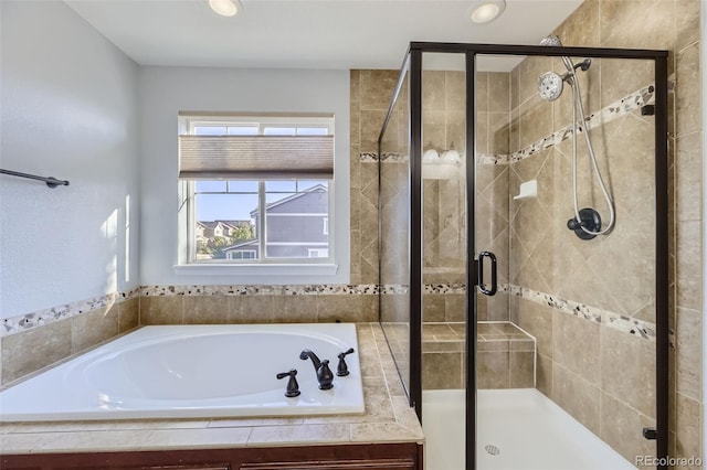 bathroom with separate shower and tub