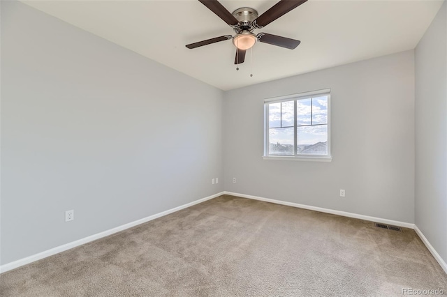 unfurnished room featuring ceiling fan and light colored carpet