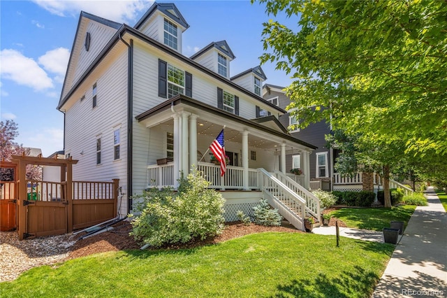 11674 Newton St, Westminster, CO 80031 - view of front facade with covered porch, a front lawn, and stairway
