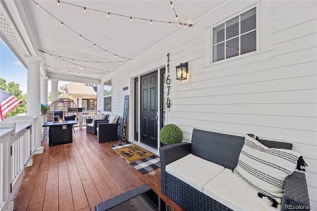 11674 Newton St, Westminster, CO 80031 - wooden deck featuring an outdoor living space with a fire pit