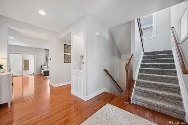 11674 Newton St, Westminster, CO 80031 - stairs featuring wood finished floors and recessed lighting