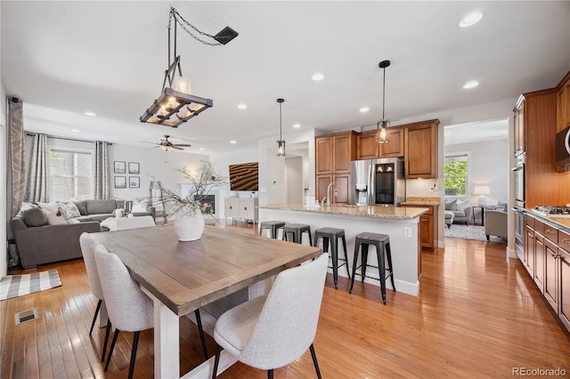 11674 Newton St, Westminster, CO 80031 - dining area with light wood-style flooring, ceiling fan, and recessed lighting