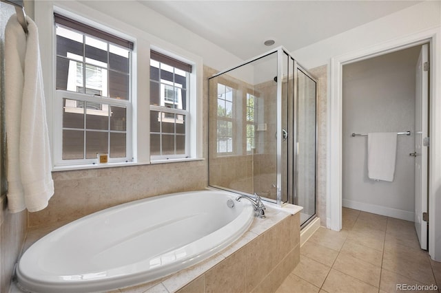 11674 Newton St, Westminster, CO 80031 - bathroom with a garden tub, a stall shower, and tile patterned flooring
