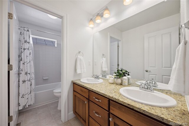 11674 Newton St, Westminster, CO 80031 - bathroom featuring double vanity, tile patterned flooring, and shower / bath combination with curtain