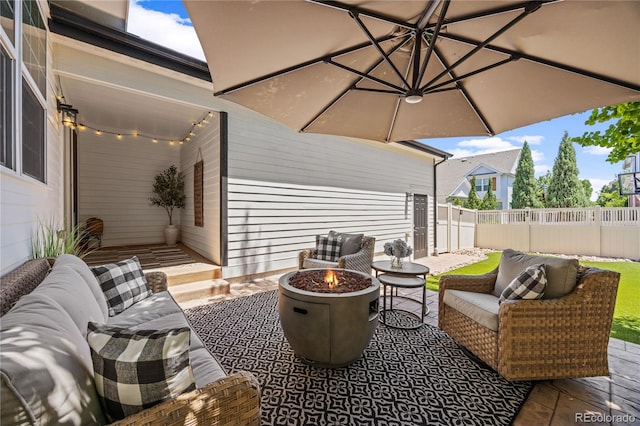 11674 Newton St, Westminster, CO 80031 - view of patio / terrace with an outdoor living space with a fire pit