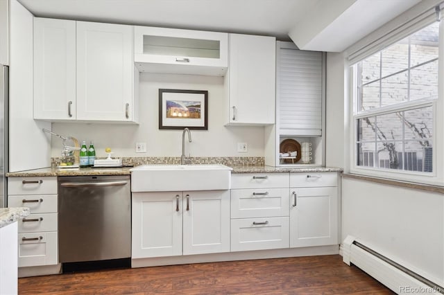 kitchen featuring sink, baseboard heating, stainless steel dishwasher, light stone countertops, and white cabinets