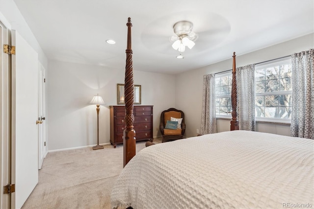 bedroom featuring light colored carpet and ceiling fan