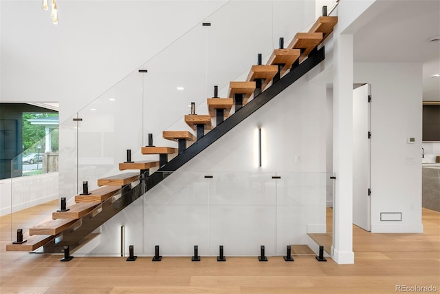 1518 S Columbine St, Denver, CO 80210 - stairs featuring wood finished floors, a towering ceiling, baseboards, and recessed lighting