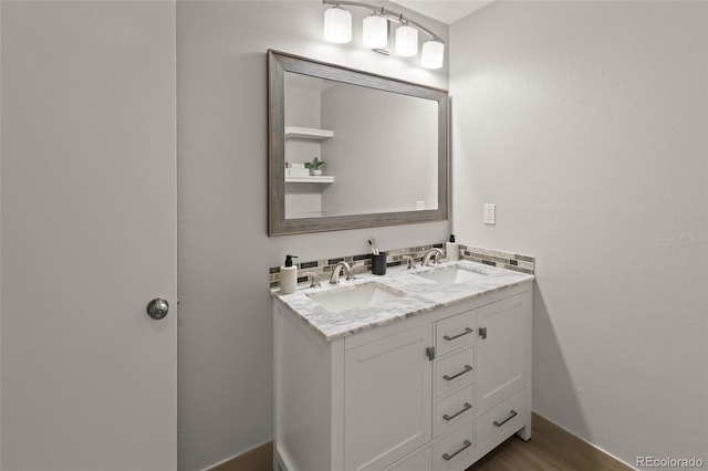 3458 S Norfolk Way, Aurora, CO 80013 - bathroom featuring double vanity and wood finished floors