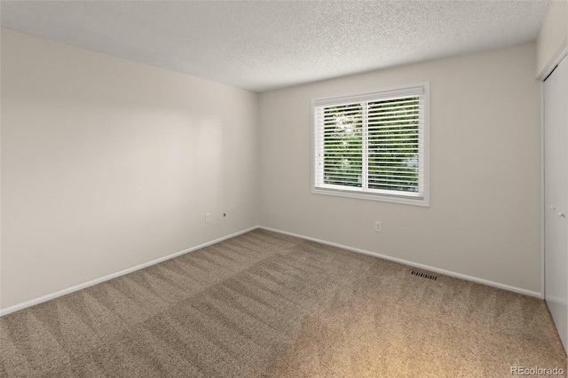 3458 S Norfolk Way, Aurora, CO 80013 - spare room with carpet floors and a textured ceiling
