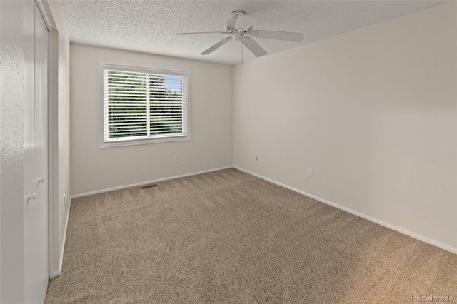 3458 S Norfolk Way, Aurora, CO 80013 - unfurnished room with a ceiling fan, carpet floors, and a textured ceiling