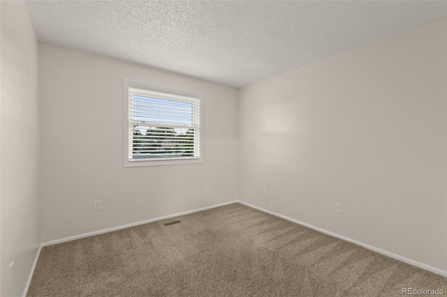 3458 S Norfolk Way, Aurora, CO 80013 - unfurnished room featuring carpet flooring and a textured ceiling