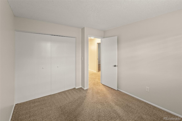 3458 S Norfolk Way, Aurora, CO 80013 - unfurnished bedroom with carpet floors, a textured ceiling, and a closet
