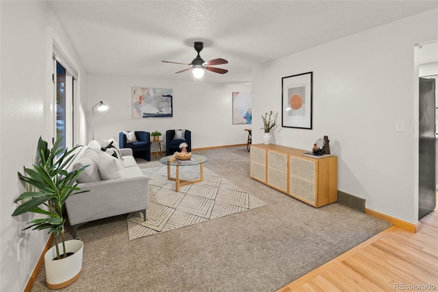 3458 S Norfolk Way, Aurora, CO 80013 - carpeted living room featuring ceiling fan, wood finished floors, and a textured ceiling