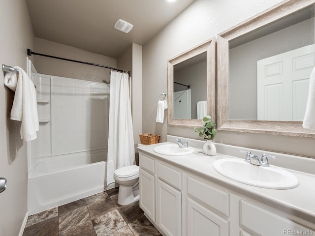 full bathroom with toilet, vanity, and shower / tub combo with curtain