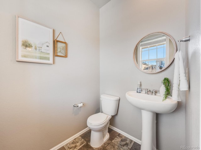 bathroom featuring sink and toilet