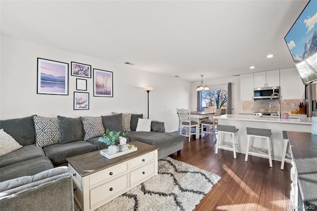 living room with dark hardwood / wood-style floors