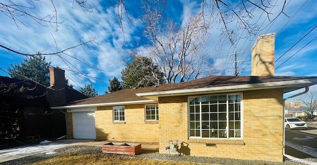 back of house with a garage