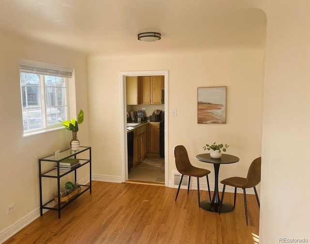 interior space featuring sink and light wood-type flooring