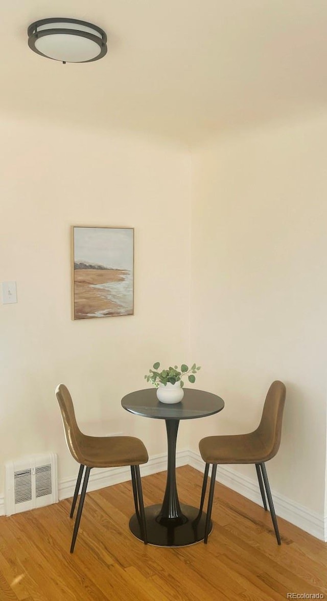 dining area with light hardwood / wood-style floors