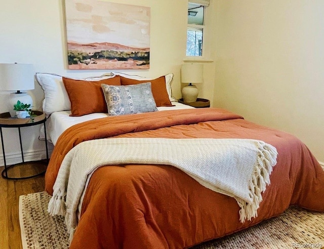 bedroom featuring hardwood / wood-style floors