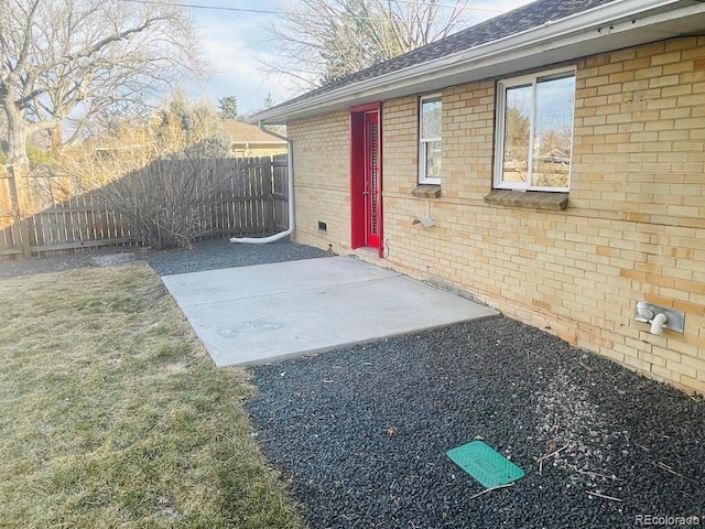 property entrance featuring a patio area