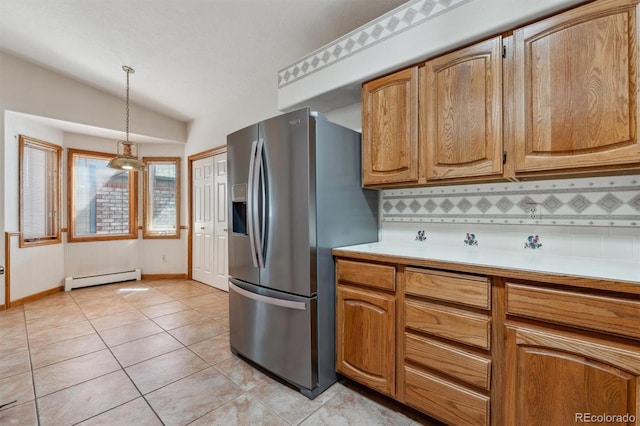 2010 46th Ave Unit 20, Greeley, CO 80634 - kitchen featuring stainless steel refrigerator with ice dispenser, baseboard heating, decorative backsplash, lofted ceiling, and light countertops