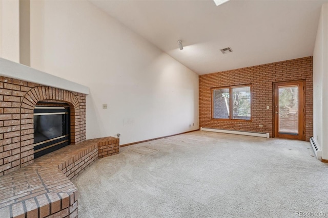 2010 46th Ave Unit 20, Greeley, CO 80634 - unfurnished living room featuring a baseboard heating unit, lofted ceiling, brick wall, carpet floors, and a fireplace