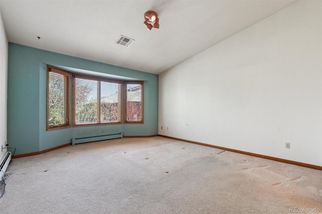 2010 46th Ave Unit 20, Greeley, CO 80634 - unfurnished room featuring a baseboard radiator, carpet floors, lofted ceiling, and baseboards