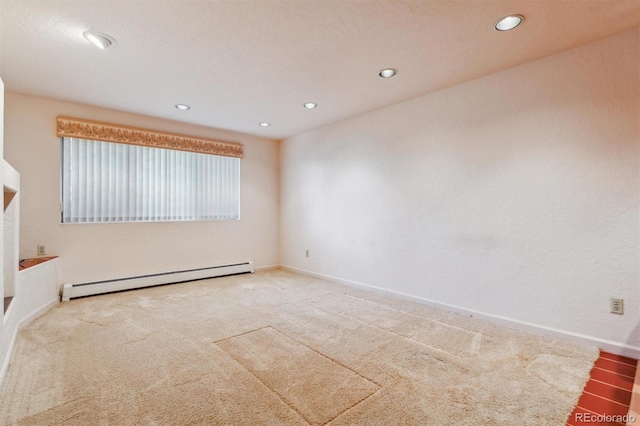 2010 46th Ave Unit 20, Greeley, CO 80634 - spare room featuring a baseboard heating unit, carpet, recessed lighting, and baseboards
