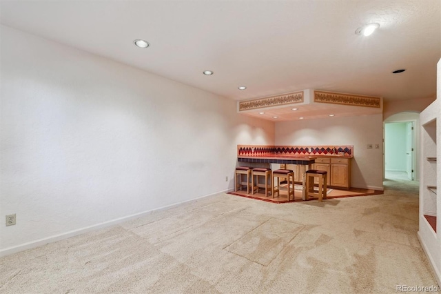 2010 46th Ave Unit 20, Greeley, CO 80634 - living room with a dry bar, carpet, recessed lighting, and baseboards