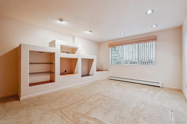 2010 46th Ave Unit 20, Greeley, CO 80634 - carpeted spare room with a baseboard radiator, built in features, baseboards, and recessed lighting