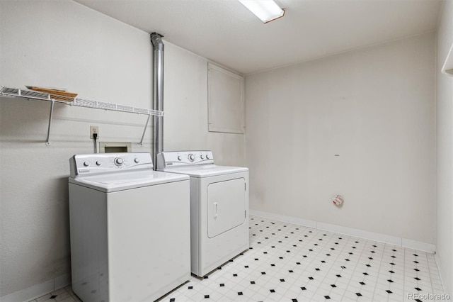 2010 46th Ave Unit 20, Greeley, CO 80634 - laundry room featuring independent washer and dryer, baseboards, and light floors