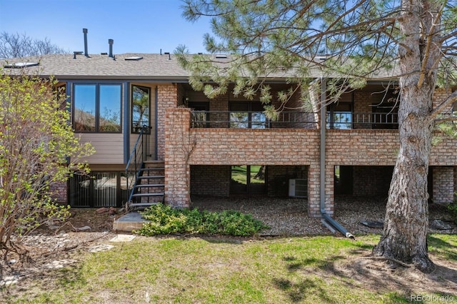 2010 46th Ave Unit 20, Greeley, CO 80634 - back of property with stairway, cooling unit, and brick siding