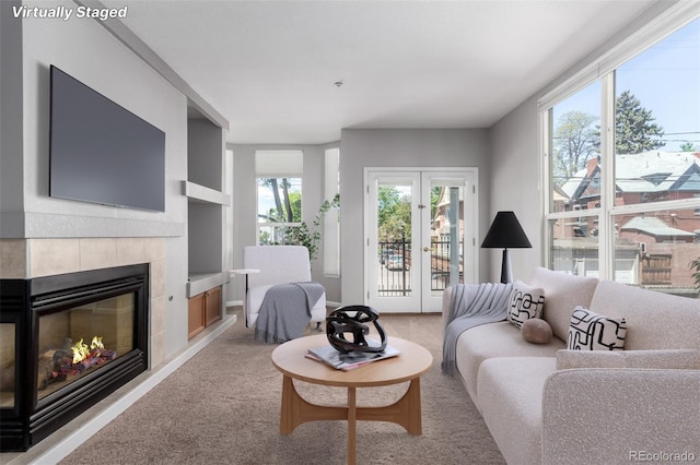 1521 Vine St Unit 108, Denver, CO 80206 - living room with light colored carpet and a tile fireplace
