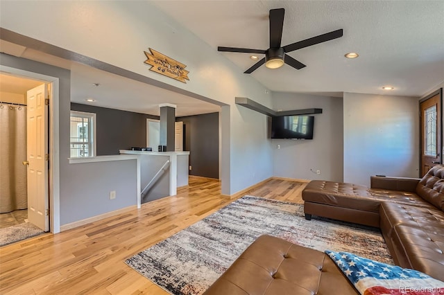 living room featuring recessed lighting, baseboards, wood finished floors, and ceiling fan